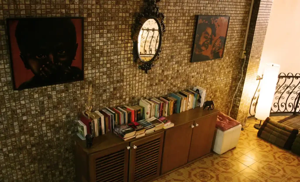 Decorated common area and book exchange at Born Free Hostel Bangkok