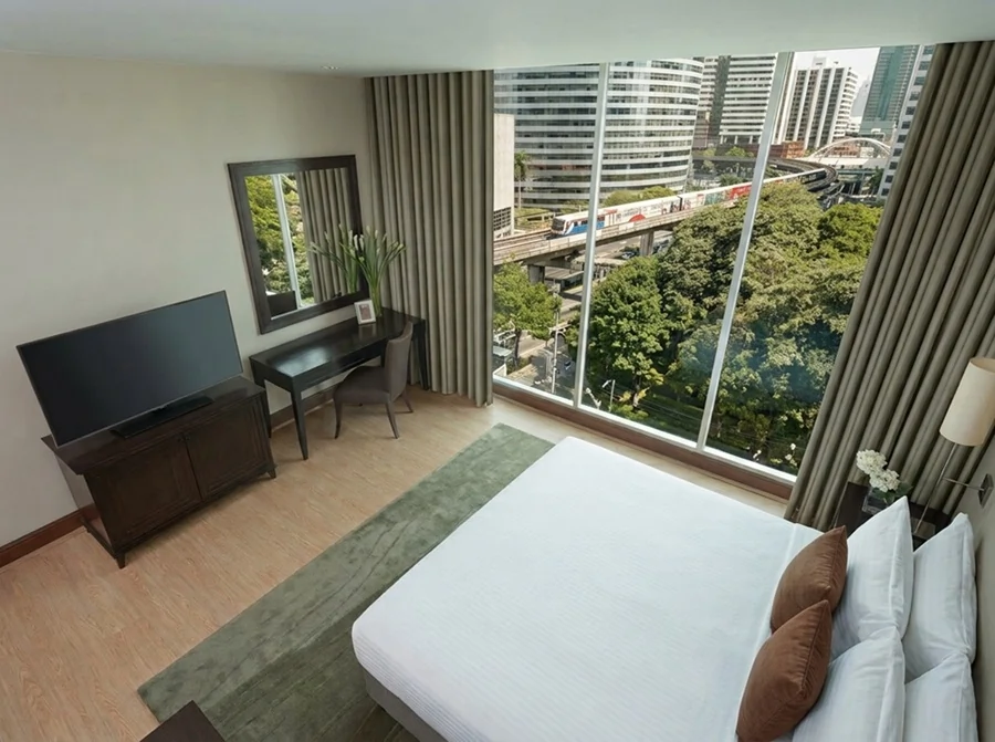 Apartment bedroom with Bangkok city view at Ascott Sathorn Bangkok