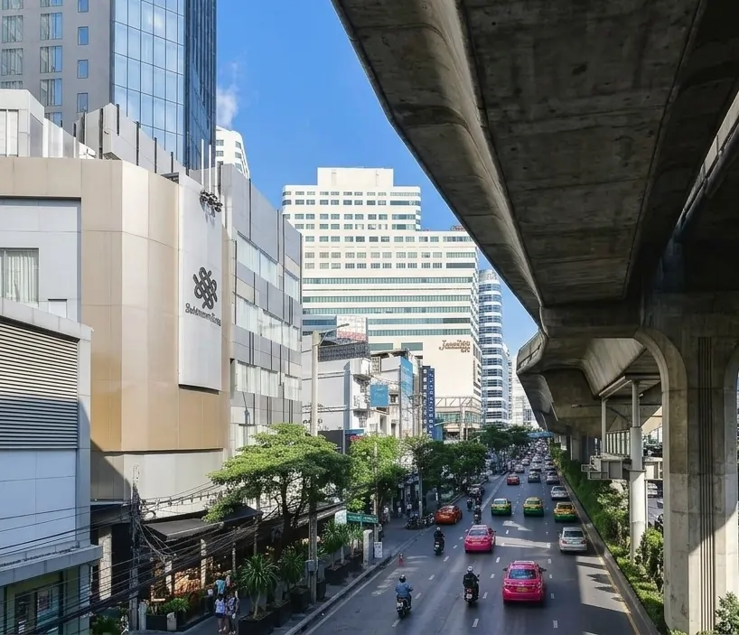 Sukhumvit Road traffic beneath the elevated BTS railway near Asok in Bangkok